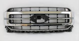 GRILLE- MATTE GREY- W/ CENTER CHROME MOULDINGS- W/ BLACK ACCENTS- LARIAT MODEL- STANDARD EQUIPMENT Hover For A